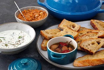 dips in mini cocottes and bowls served with bread