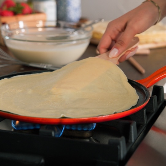 lifting the crepe from the pan