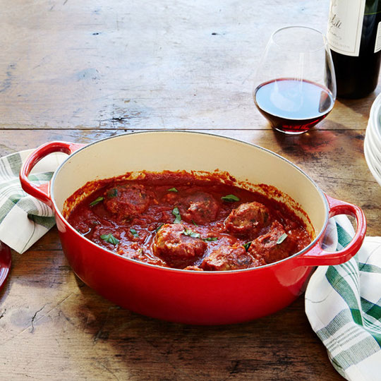 meatballs in red sauce inside a dutch oven