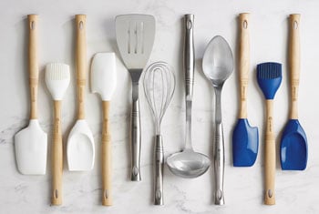 an array of le creuset utensils