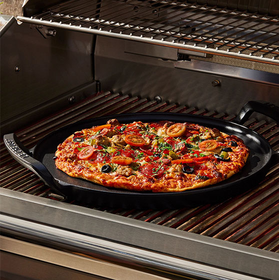 alpine pizza pan used to cook pizza on a grill