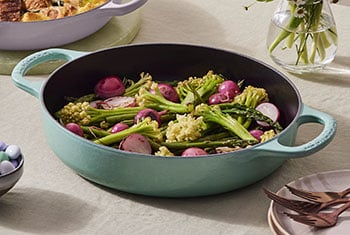 radishes and veggies in a cast iron pan