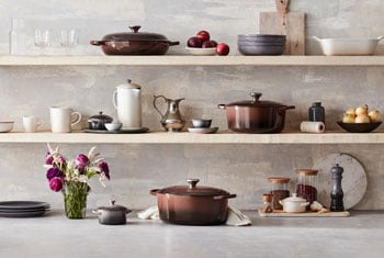 assorted colors of cookware on shelves