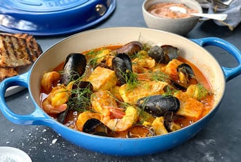 mussels in a rich sauce with vegetables