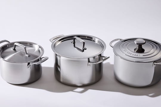 three stainless steel stockpots