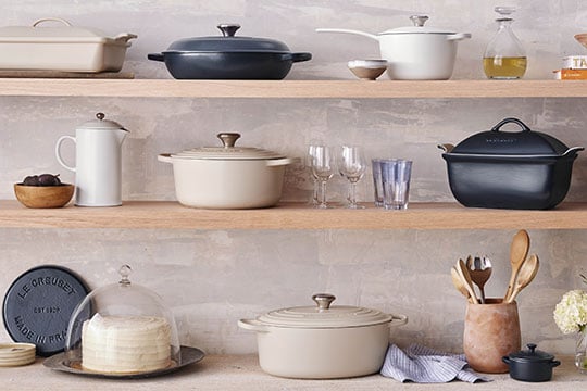 brioche, white and navy colored cookware on shelves