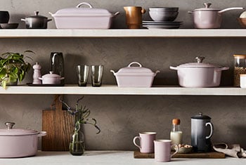 assorted cookware including shallot and oyster on shelves