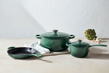 cast iron cookware set in artichaut green