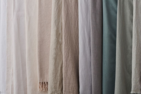 assortment of linen fabrics in neutral tones