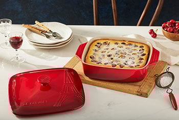 cherry cake baked in a lidded red baker