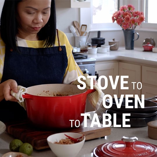 chef places hot dutch oven on cutting board