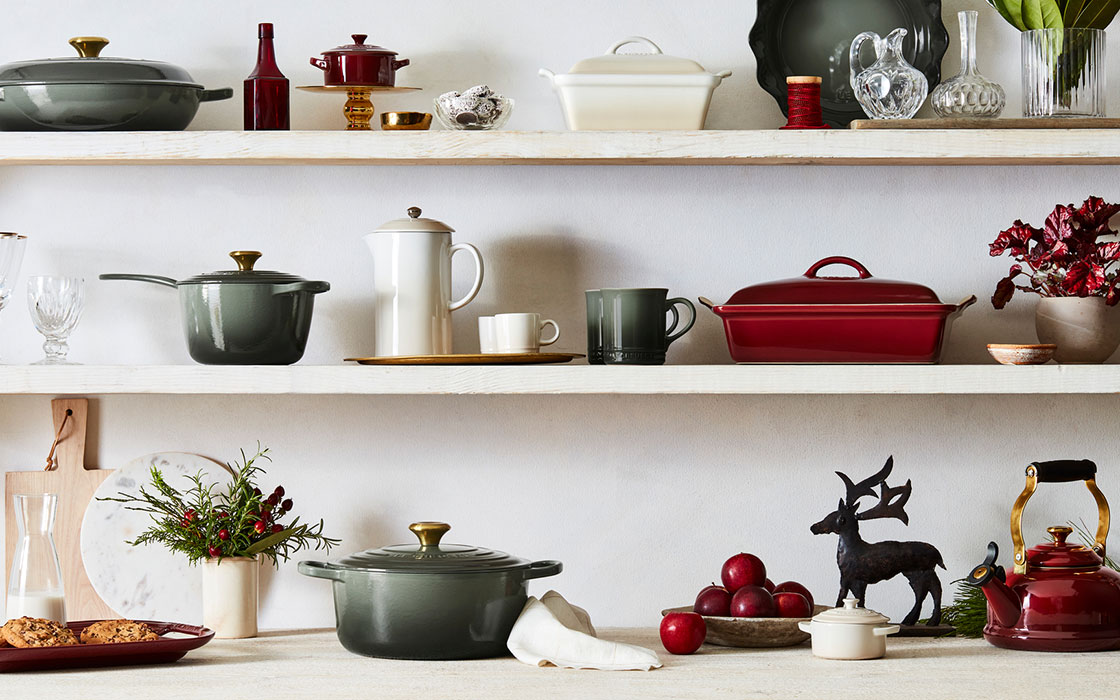 shelves filled with cookware and holiday decor