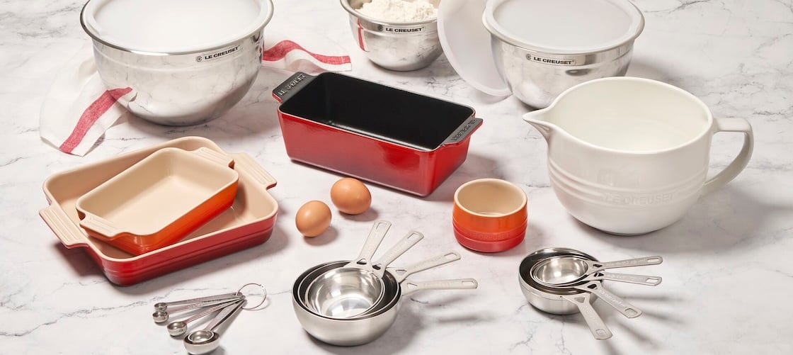 assorted Le Creuset cookware and accessories