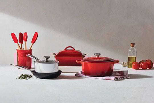 assorted cookware and tools in cerise red