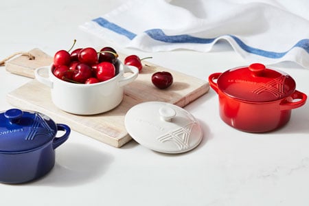 mini cocottes in red white and blue with the eiffel tower embossed on the lids