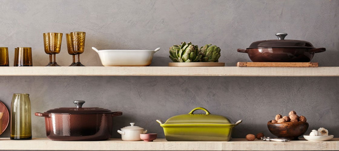 cookware in olive green, ganache brown and meringue on a shelf