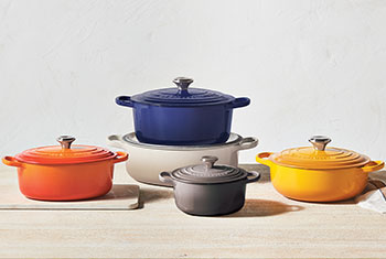 assorted sizes and colors of dutch ovens