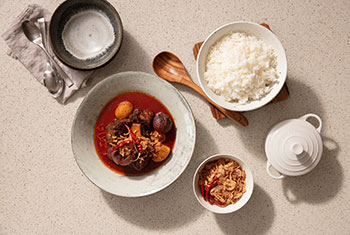 beef in red curry served with white rice