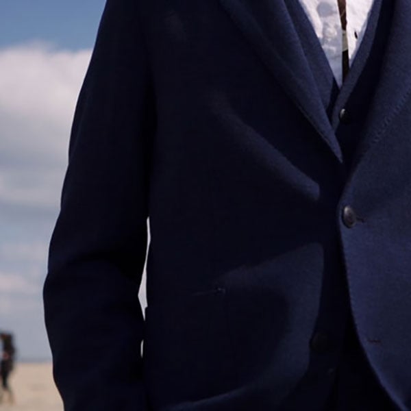 man wearing navy suit