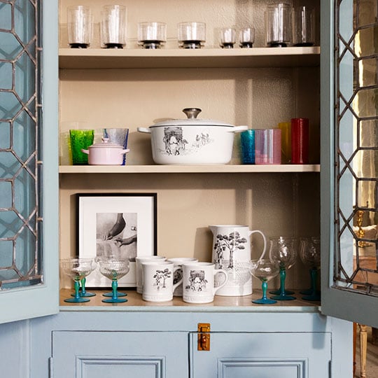 white cookware with a handcrafted toile pattern