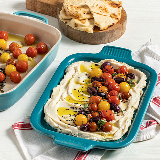 tomato topped homemade hummus