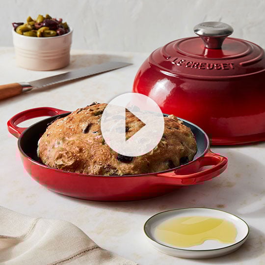 rustic bread in a red bread oven