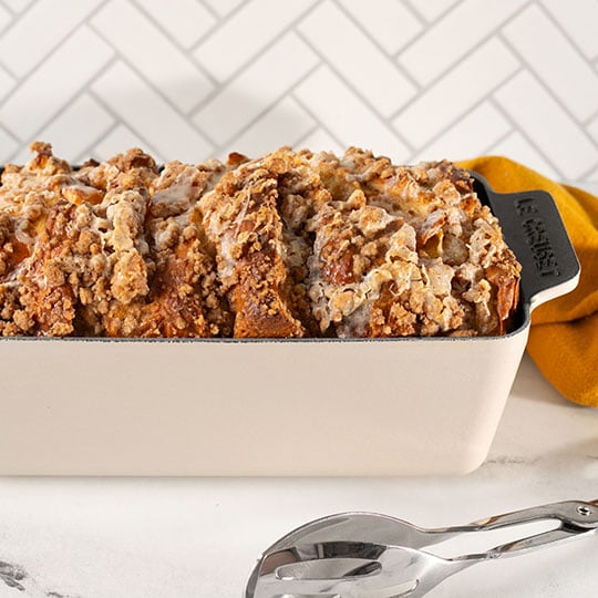 streusel topped bread pudding loaf in a loaf pan - links to recipe