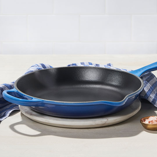 blue cast iron skillet on counter