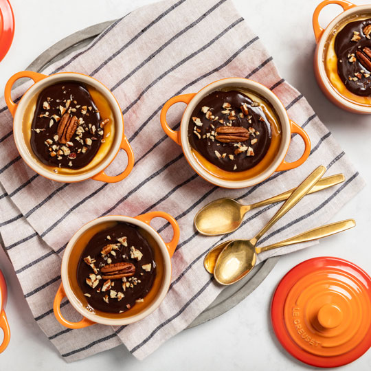 chocolate topped desserts in mini cocottes