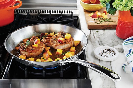 https://www.lecreuset.com/on/demandware.static/-/Sites-LeCreuset-Library/default/dwdb235a65/images/blog/tips-techniques/which-skillet/Stainless-Fry-Pan-Sauce-540x360.jpg