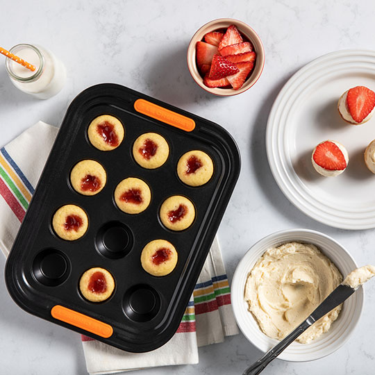 strawberry muffins in a non-stick muffin pan