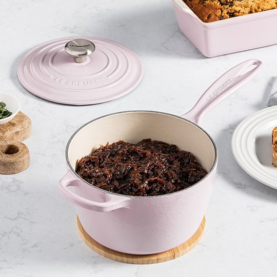 caramelized shallots in a soft pink saucepan