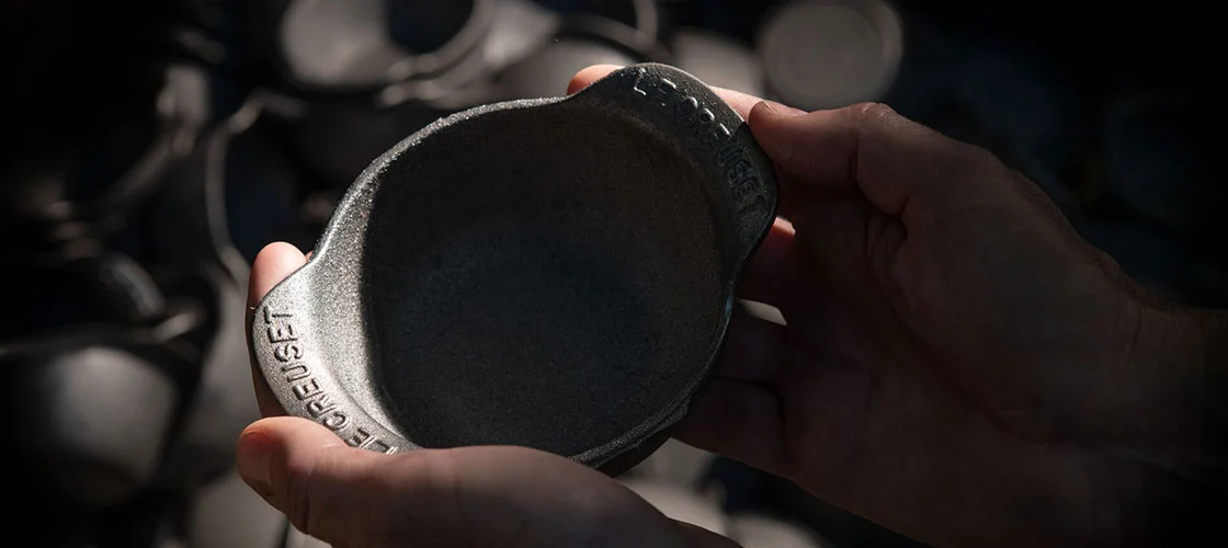 inspecting the finished cookware by hand