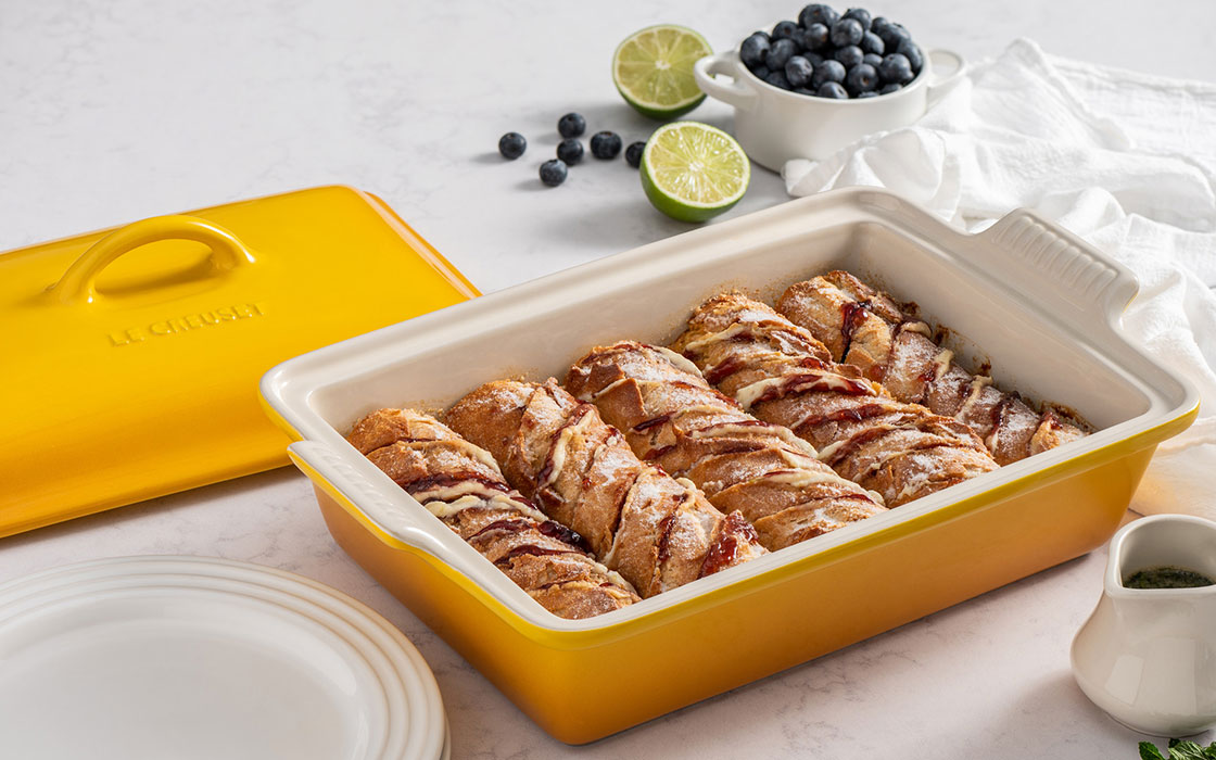 rounds of baguette bread in a stoneware baker