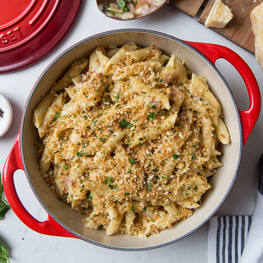 mac and cheese topped with herbs and bread crumbs