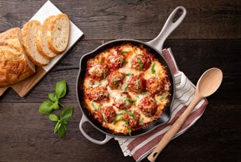 cheesy meatballs in a skillet
