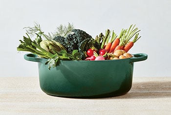 veggies overflowing from a dutch oven