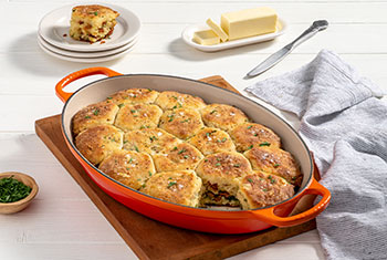 red oval baker filled with biscuits