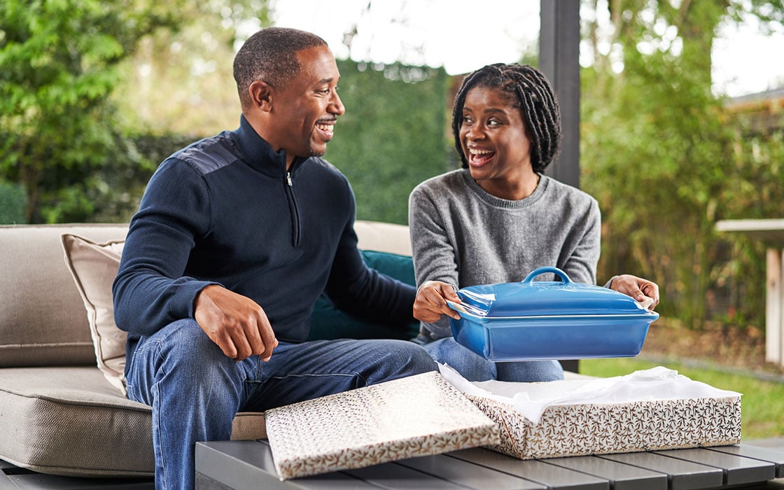 two people wrapping gifts