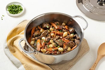 beef stew in a stainless steel pan