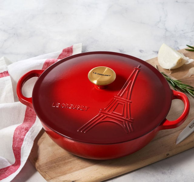 cast iron soup pot in cerise red with eiffel tower embossed on the lid
