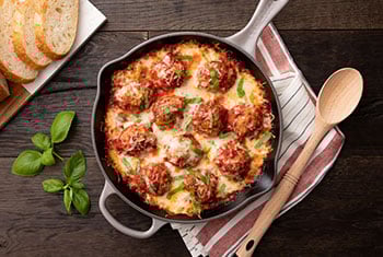 cheesy meatballs in a skillet