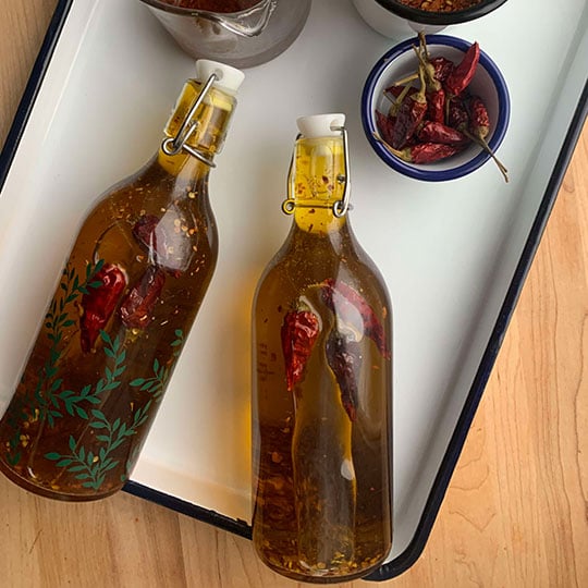bottles of olive oil with chilis