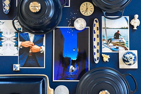 matte navy cookware shot from above surrounded by navy colored items