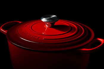 dramatically lit red dutch oven
