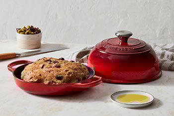 bread in a red cast iron bread oven