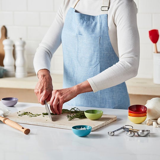 chopping herbs and veggies