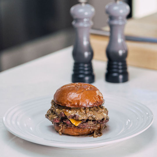gourmet cheeseburger on a brioche bun