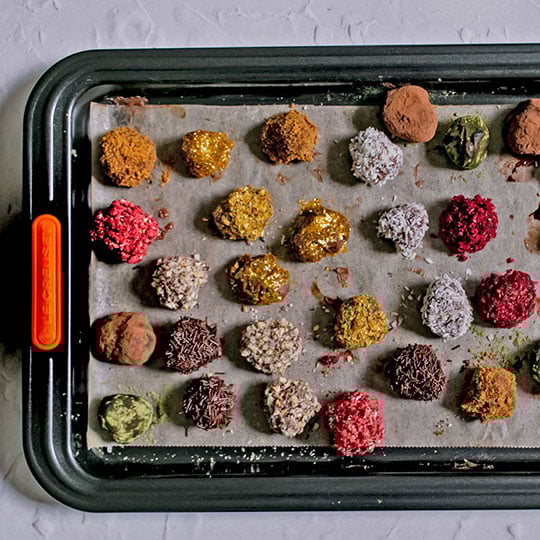 assorted truffles on a sheet pan